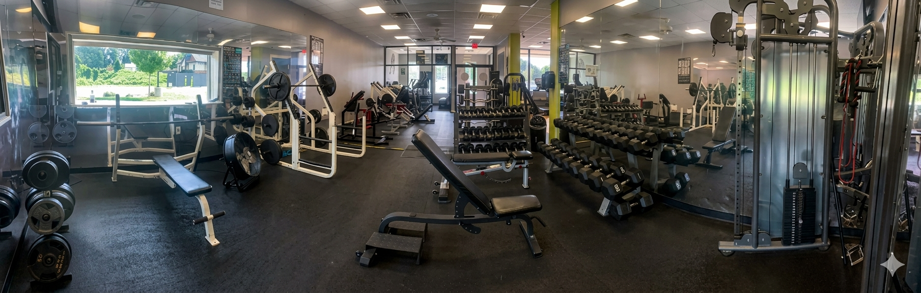 Weight plates in a dimly lit gym